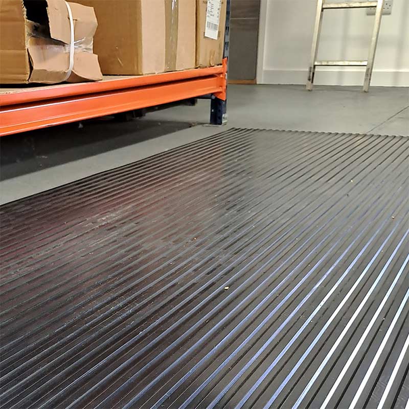 Wide rib rubber matting used on warehouse floor