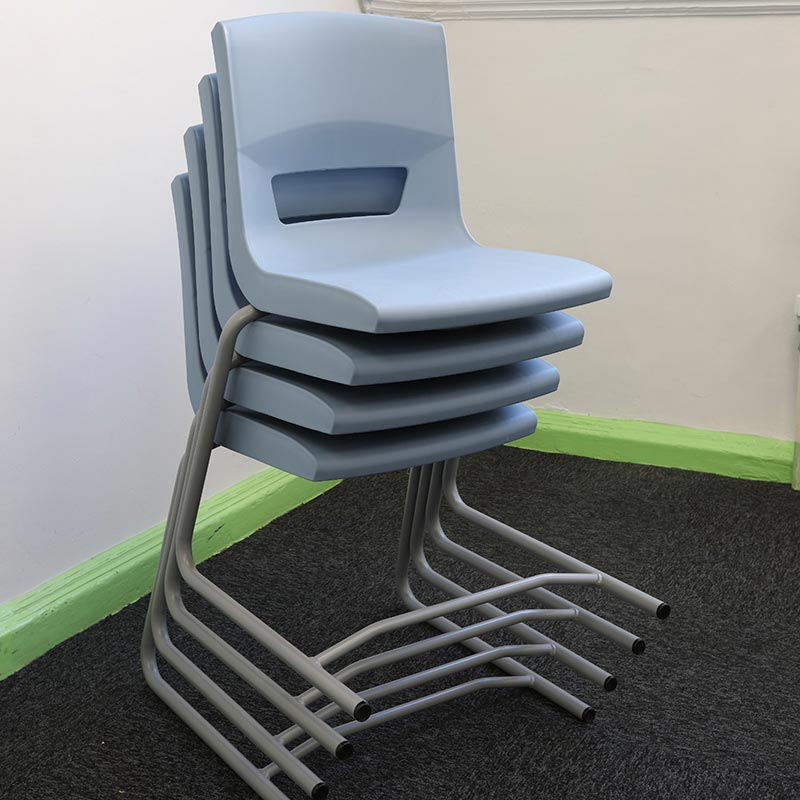 Stackable Postura reverse cantilever school chairs