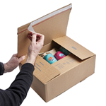 Cardboard postage box with self-adhesive strip